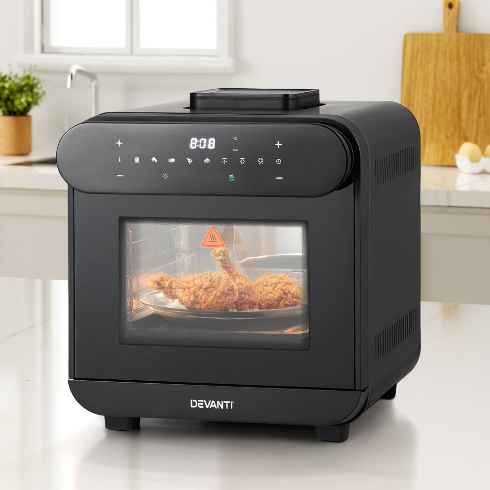 Black Devanti oven with a dish of fried chicken inside on a kitchen counter.