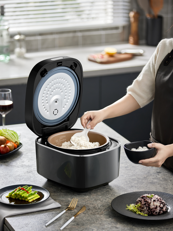 Side profile of BEAR 4L smart rice cooker showing ergonomic design.