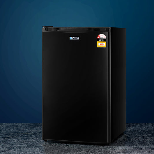Black refrigerator on a dark blue background