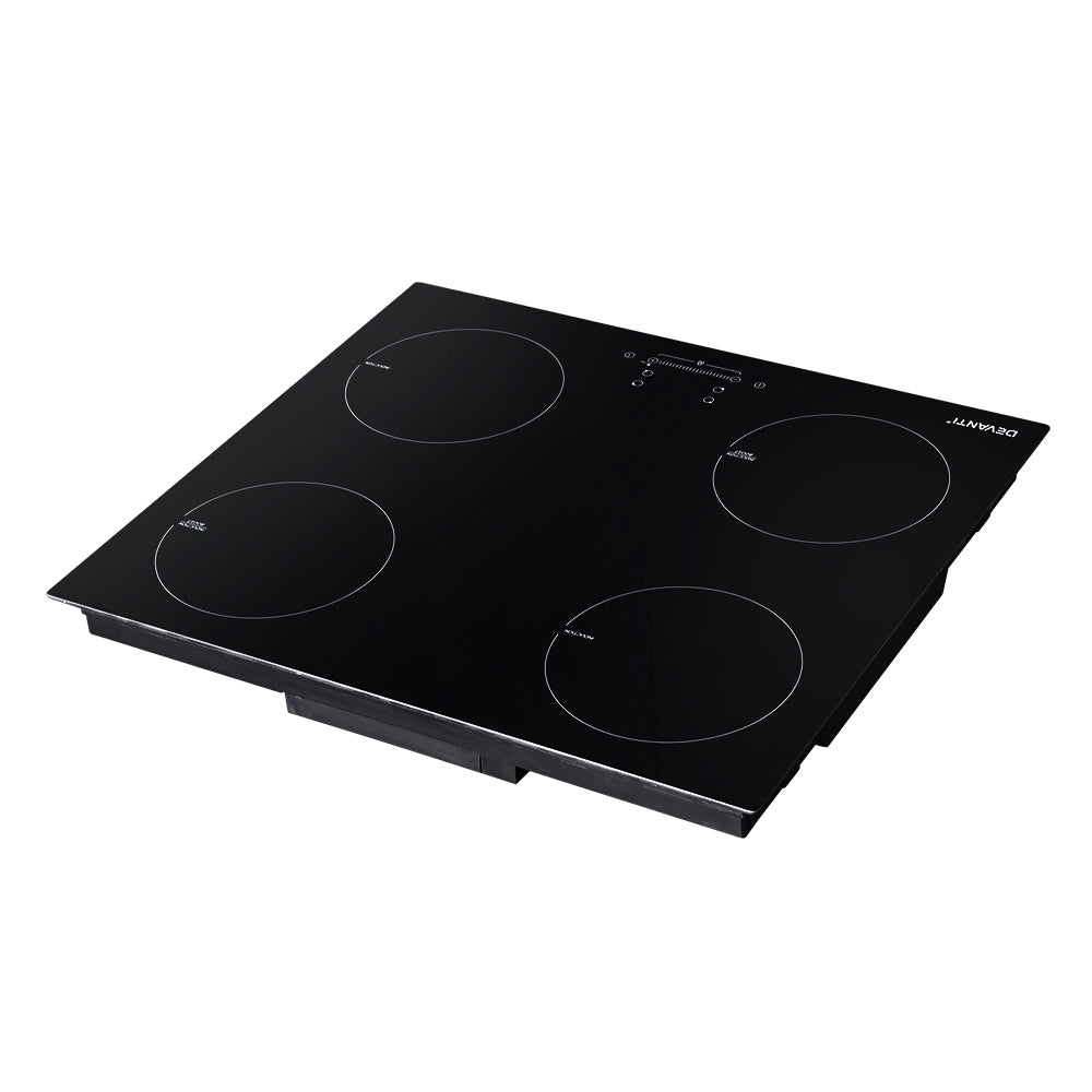 Black electric cooktop with four heating zones on a white background