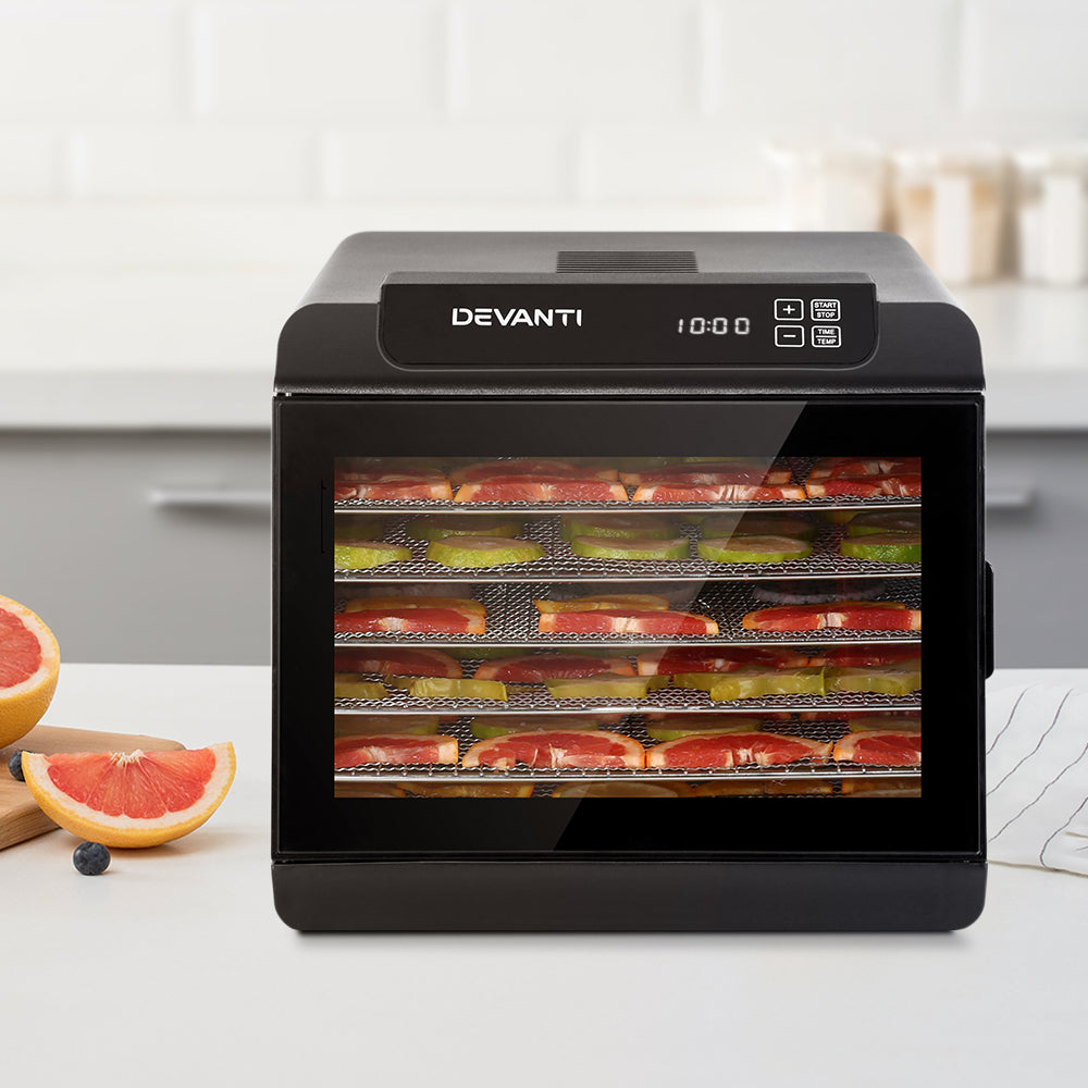 A full layout of the dehydrator with trays, power cord, and accessories included in the box.