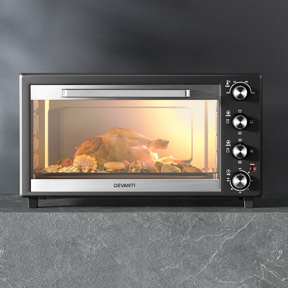 Devanti convection oven with rotisserie cooking chicken evenly