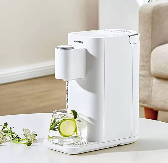 Hot water being poured from Joyoung dispenser into cup
