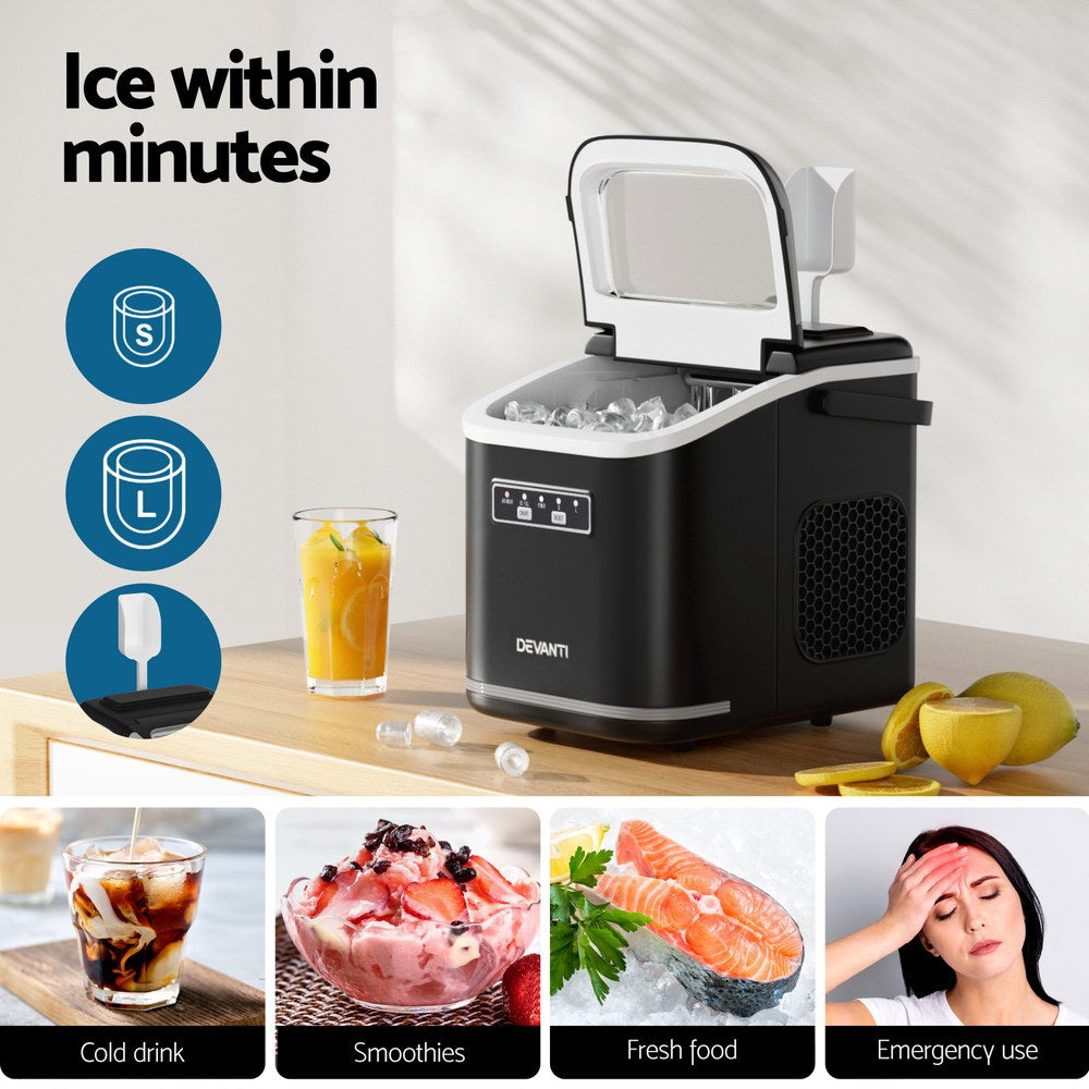 Ice cubes forming inside the Devanti ice maker with lid open, showcasing interior tray and ice production.