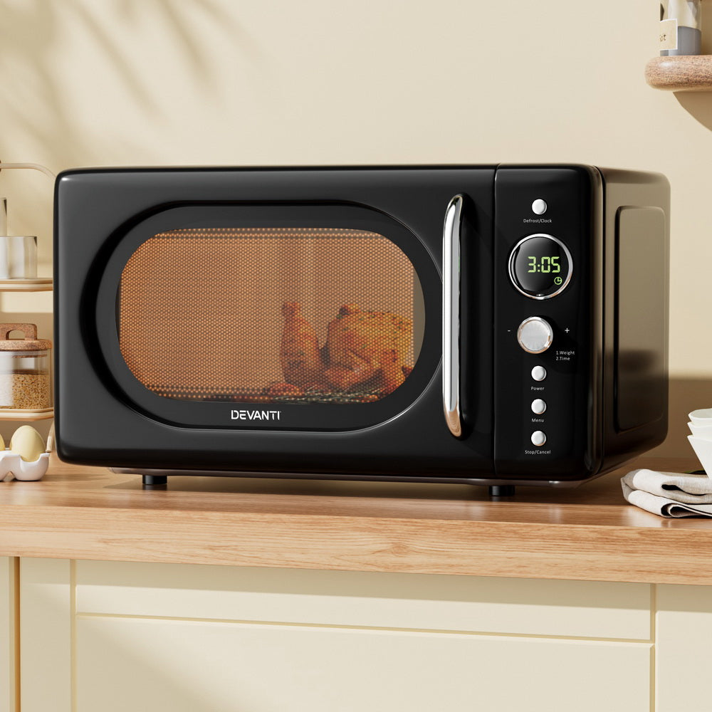 Devanti 20L microwave in a modern kitchen setting, demonstrating ease of use.