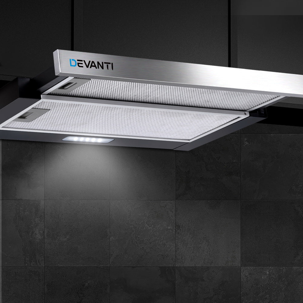 Close-up of the range hood’s underside showing the LED light and aluminium grease filters in action.