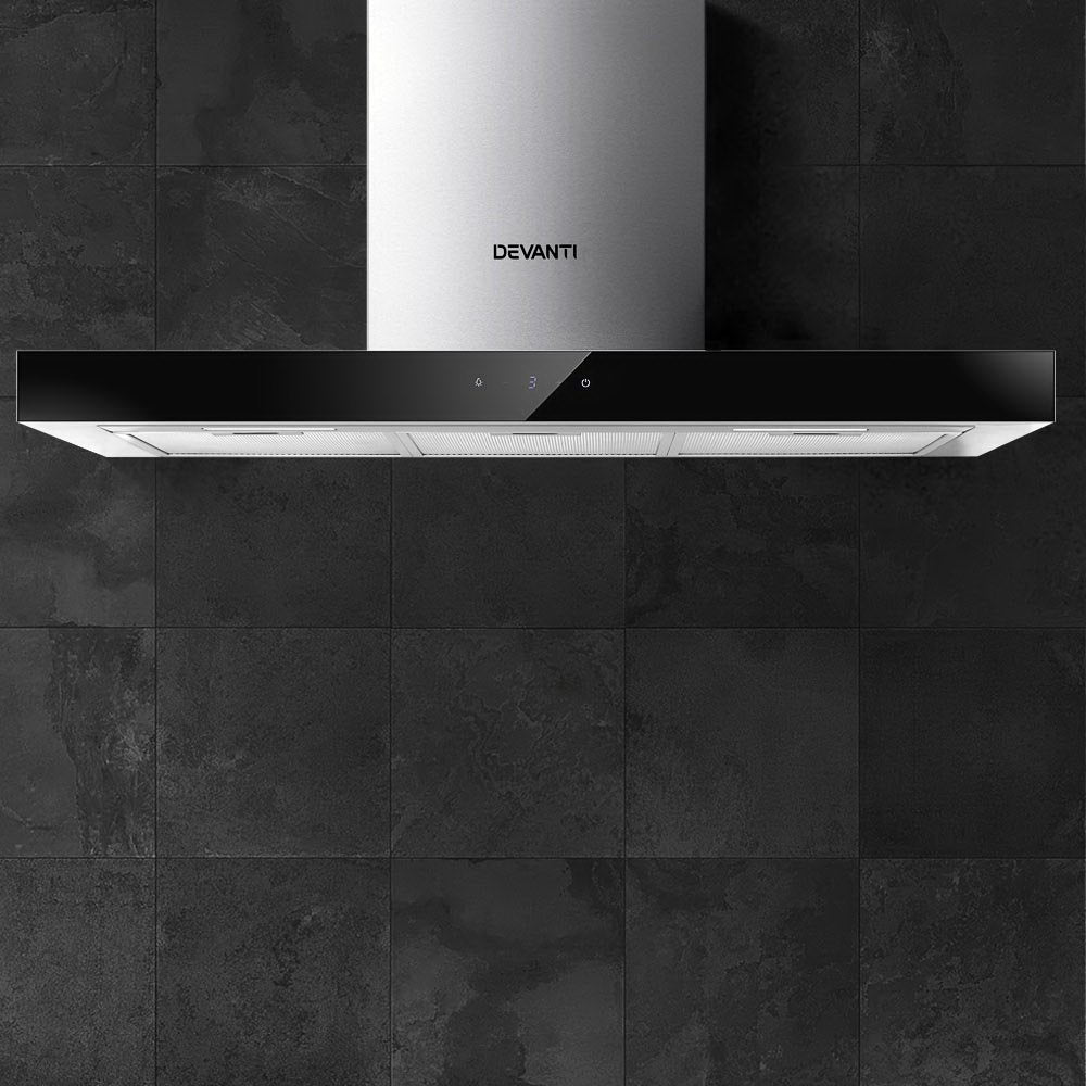 Devanti range hood in use with LED lights illuminating cooktop area.