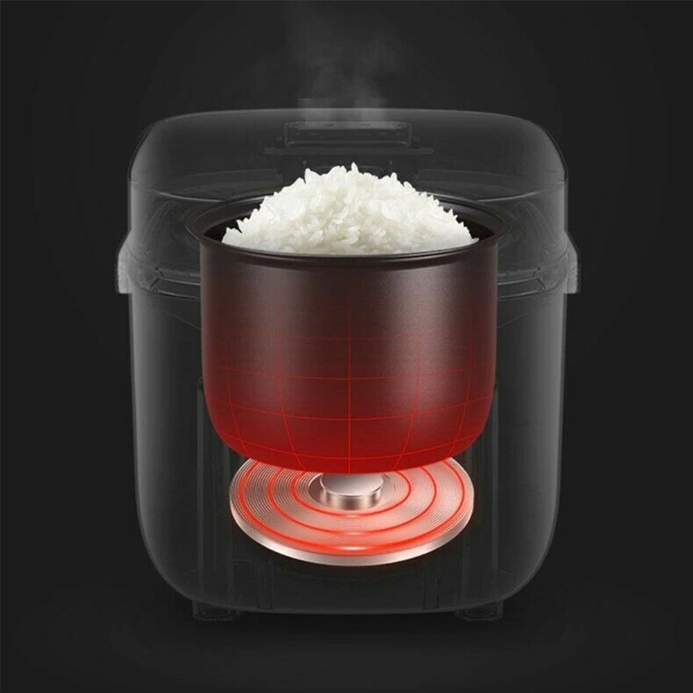 Cooked rice served from the 1.2L electric rice cooker with included spoon