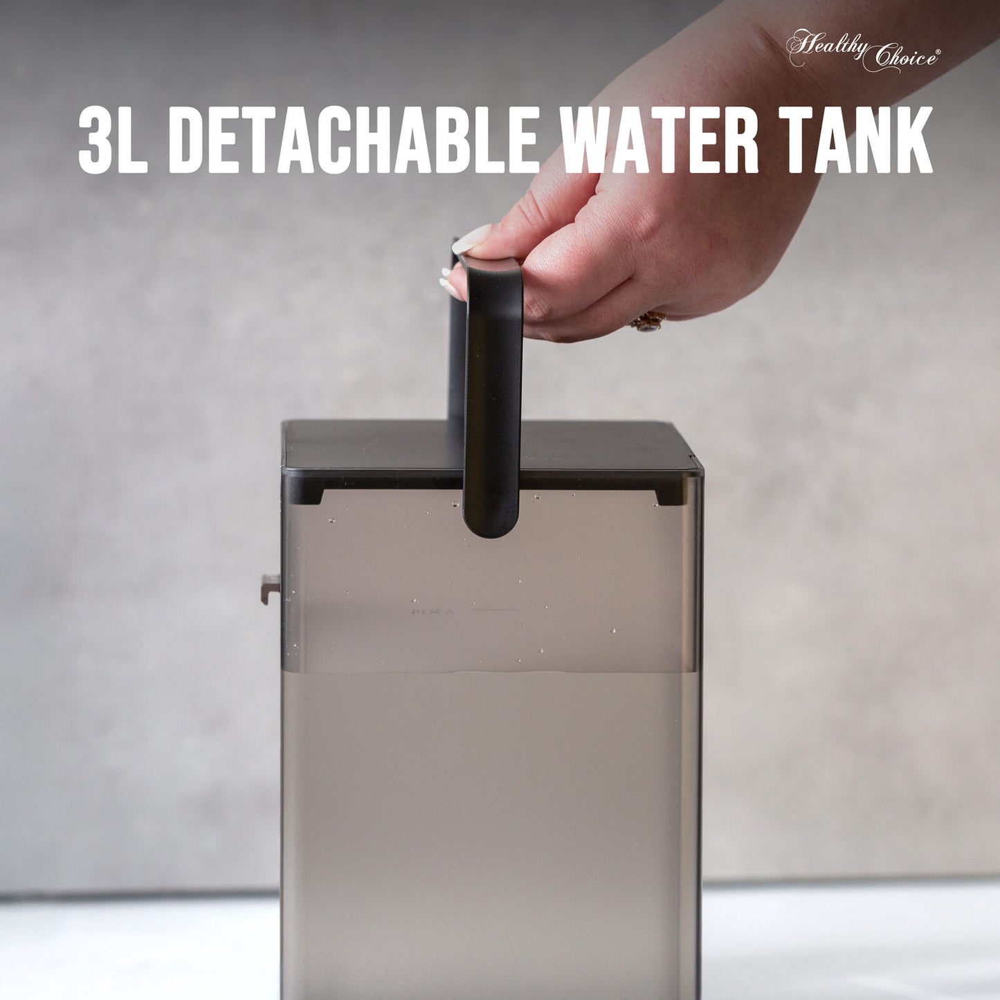 3L detachable water tank with a hand holding onto it against a neutral background
