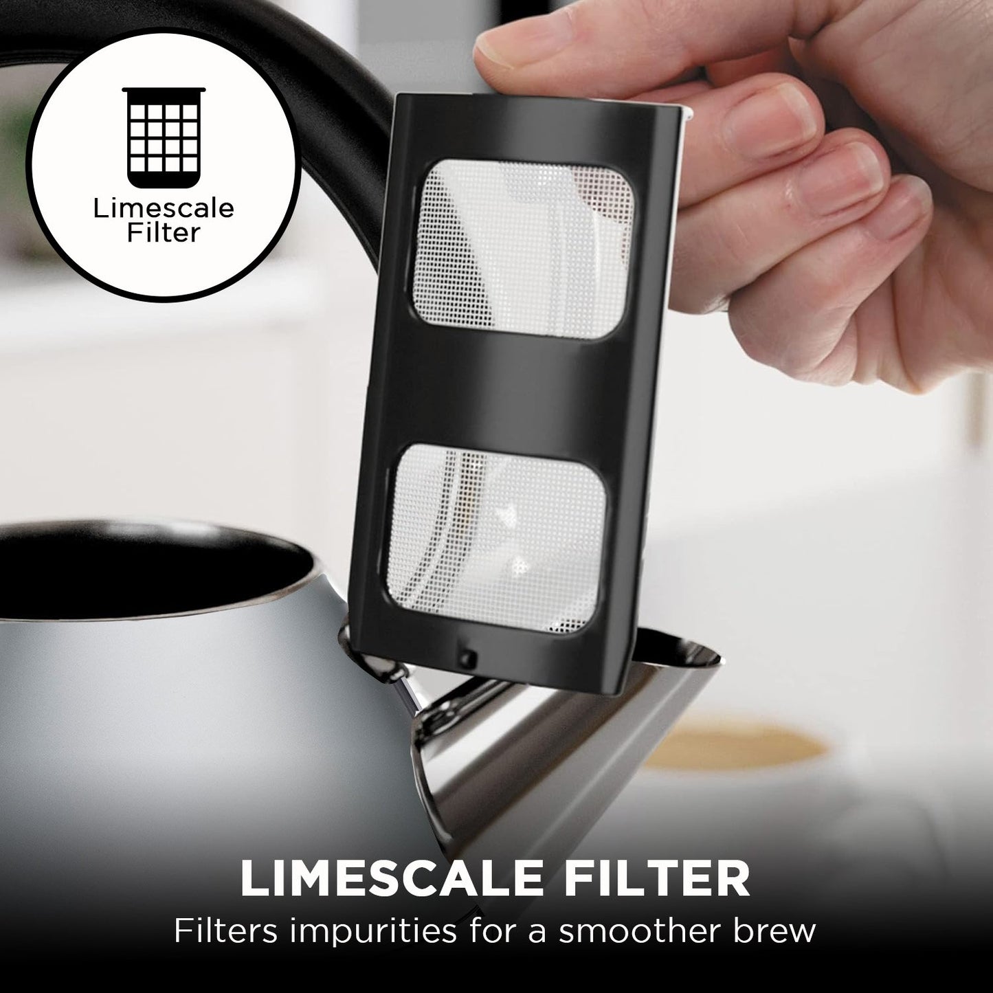 Limescale filter being held above a coffee machine with a blurred background.