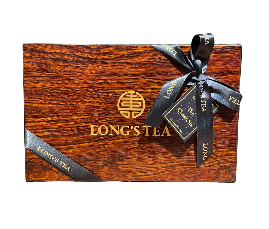 Wooden box with a black ribbon and 'Long's Tea' branding on a white background