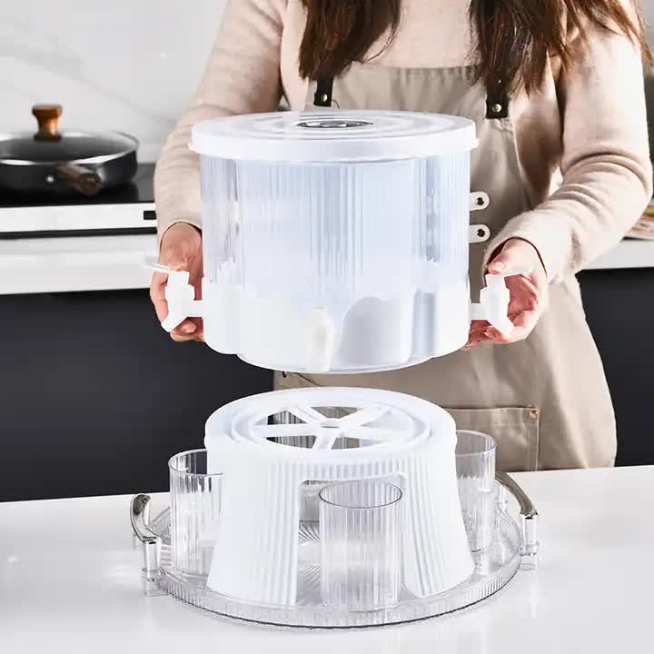 Person holding a clear kitchen spinner on a countertop