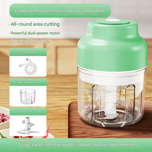 Green and white electric food chopper on a wooden surface with text highlighting features.