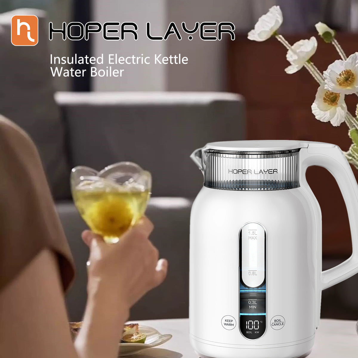 Hoper Layer insulated electric kettle with a person holding a glass of iced tea in a cozy setting.