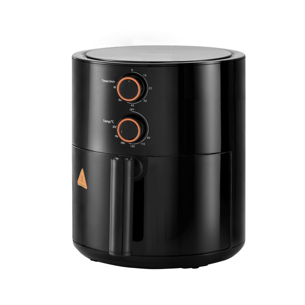 Black air fryer with control knobs on a white background