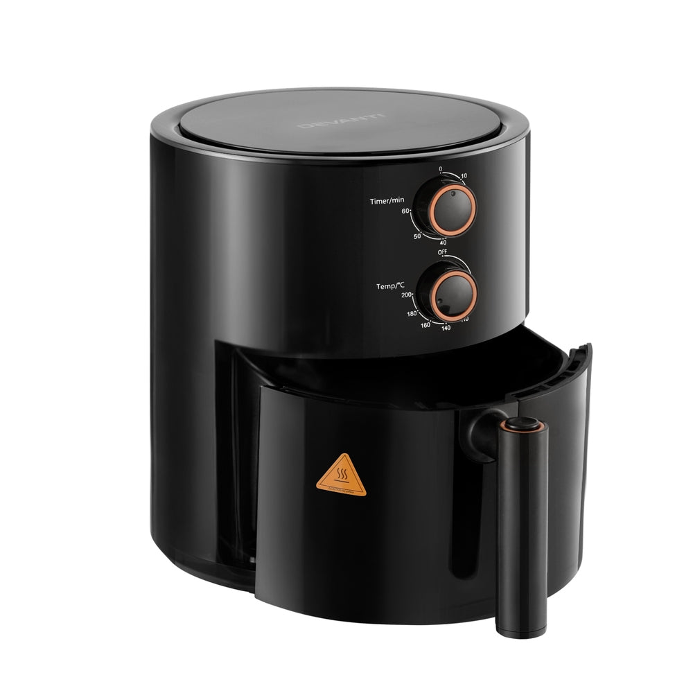 Black air fryer with control knobs on a white background