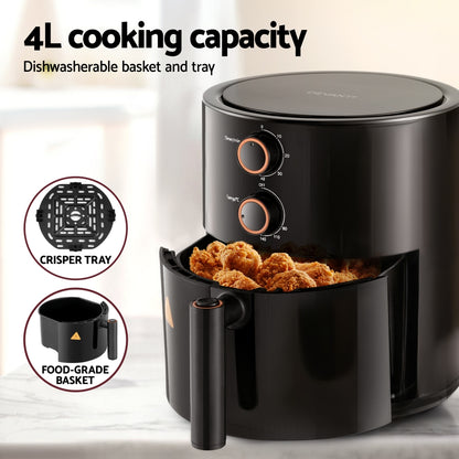Black air fryer with food inside, featuring a crisper tray and food-grade basket on a light background.