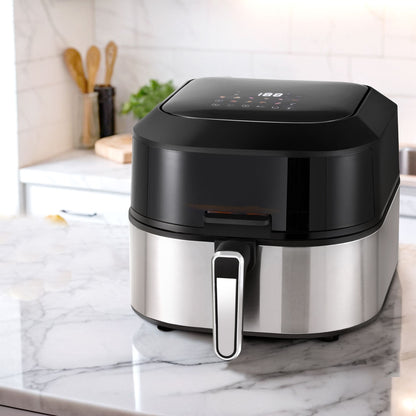 Black and silver air fryer on a marble countertop