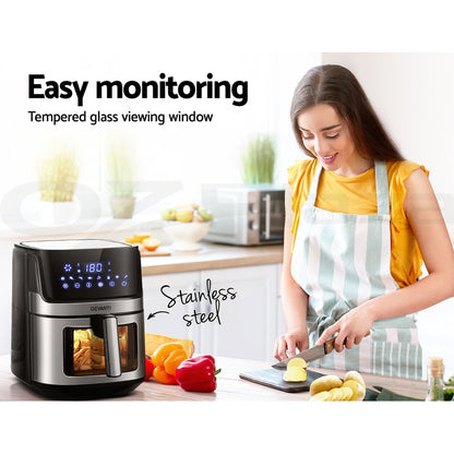 Woman in a kitchen with a digital oven and text about easy monitoring and tempered glass viewing window.