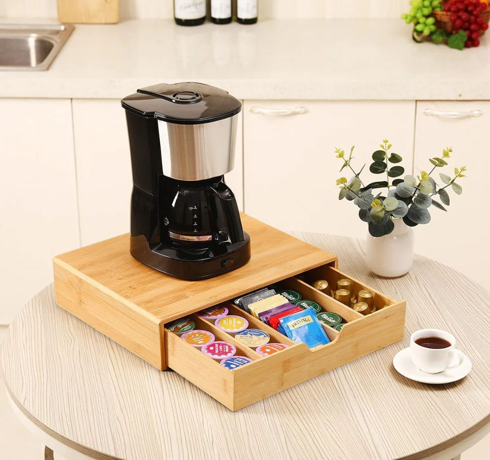 Bamboo coffee pod holder drawer opened showing four dividers
