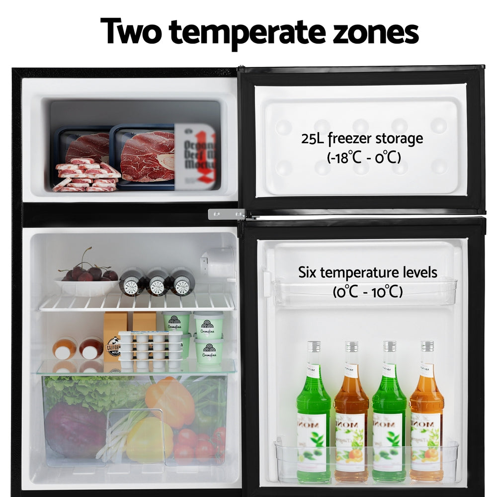 Small refrigerator with open doors showing different storage sections and temperature labels.