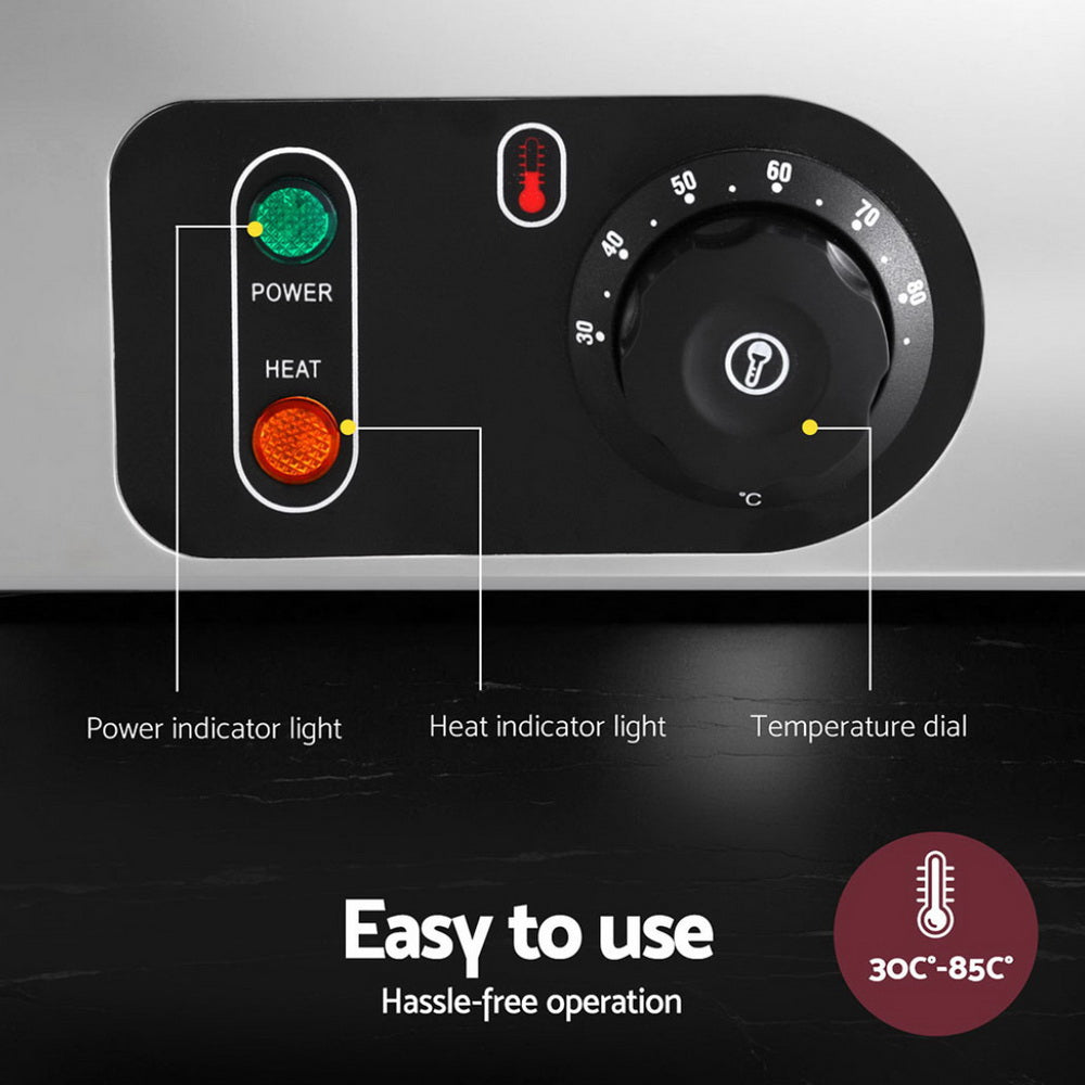 Control panel with power and heat indicator lights and a temperature dial on a metallic background.