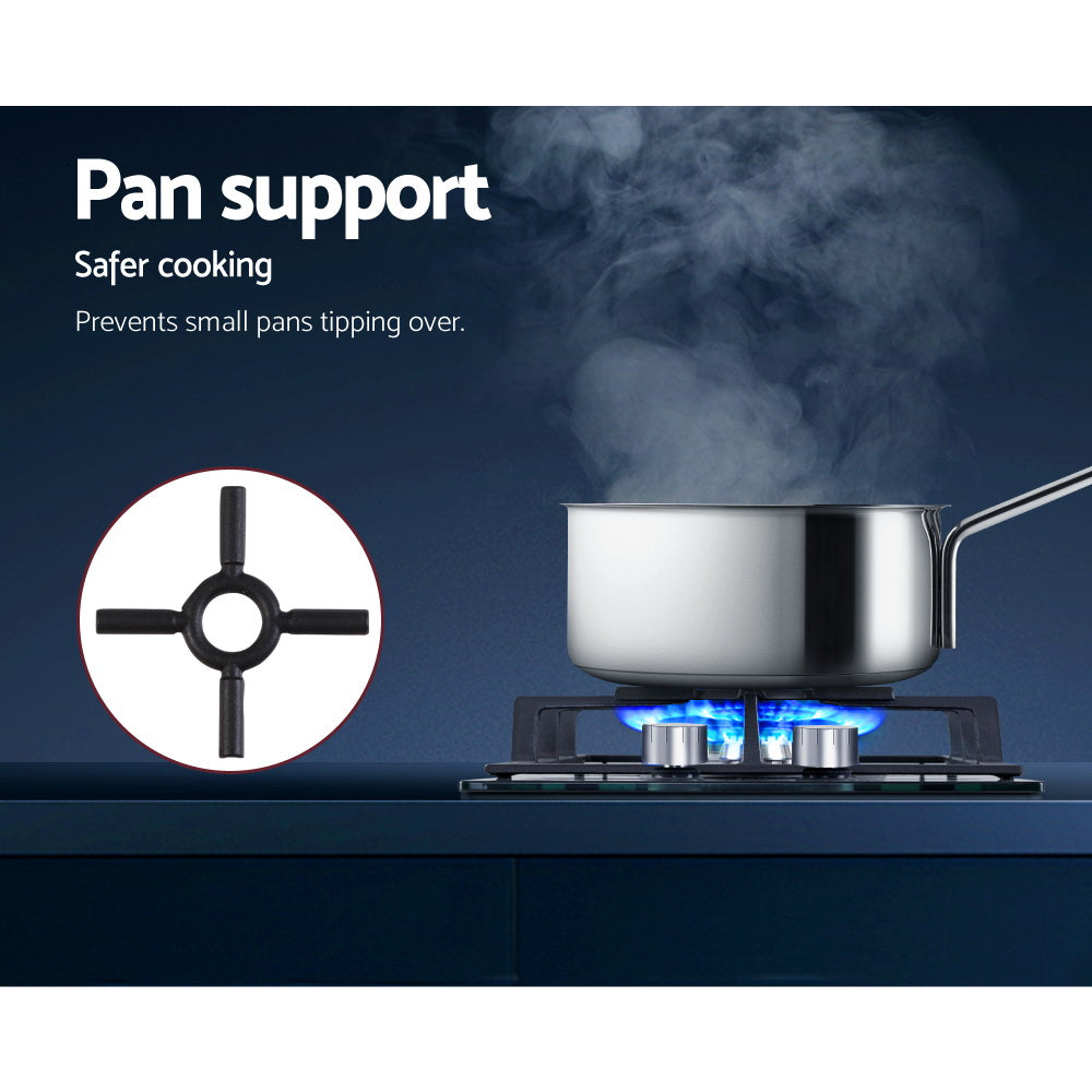 Wok burner ignited on black tempered glass surface of Devanti cooktop