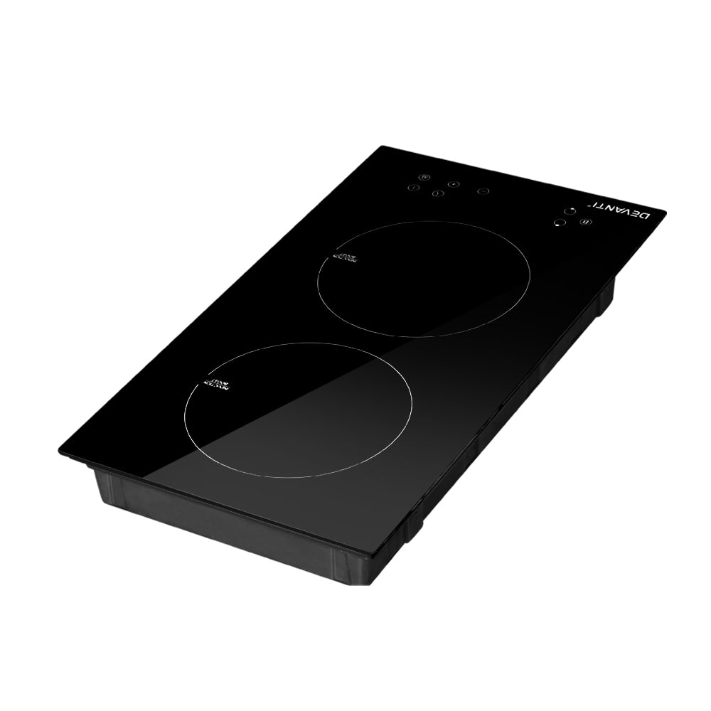 Black induction cooktop with two heating elements on a white background