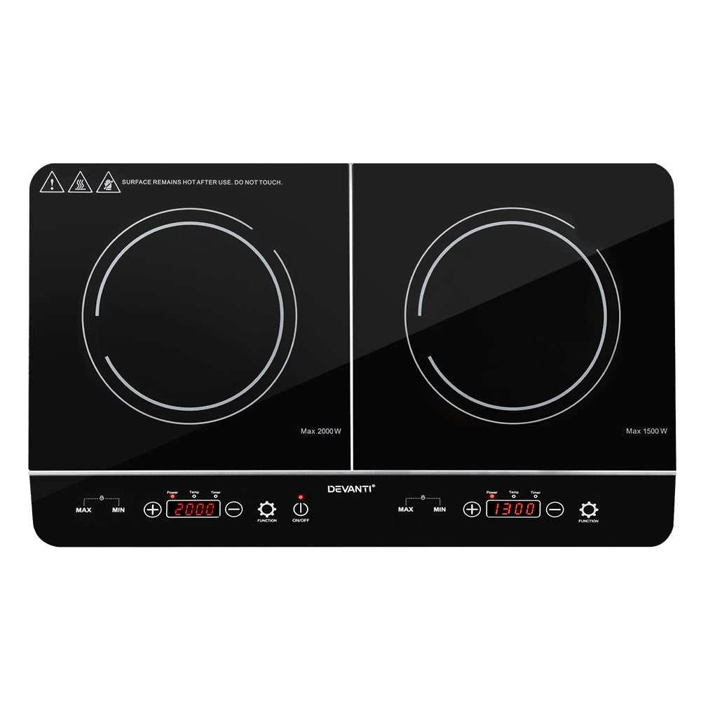 Black double induction cooktop with digital controls on a white background