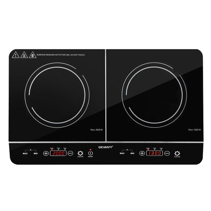 Black double induction cooktop with digital controls on a white background