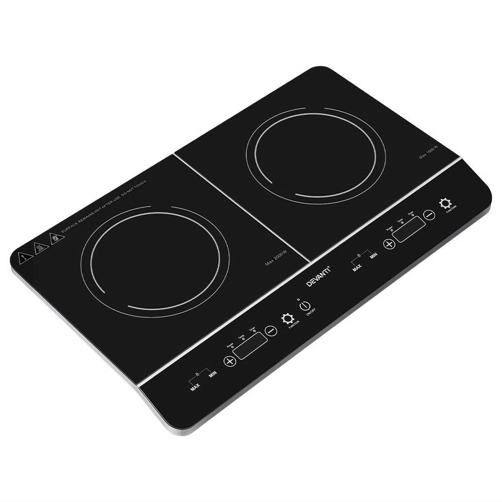 Black double induction cooktop with control panel on a white background