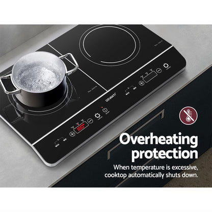 Induction cooktop with pot on a gray surface, featuring overheating protection text.