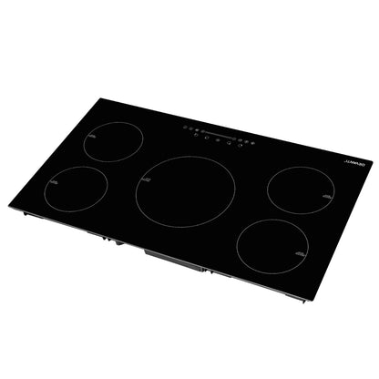Black electric cooktop with four heating elements on a white background