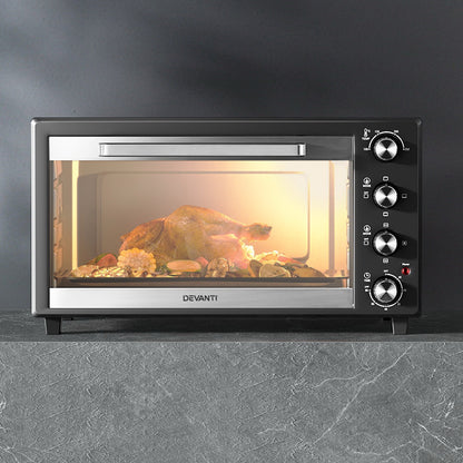Devanti convection oven with rotisserie cooking chicken evenly