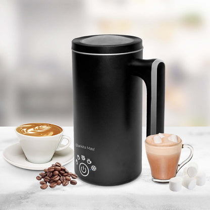 Hot milk frothing inside black milk frother jug