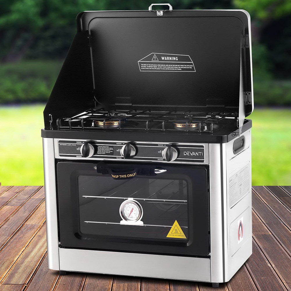 Devanti portable gas oven cooking meal outdoors with scenic background