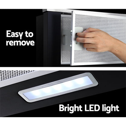 A hand pulling the Devanti range hood out, demonstrating the auto on/off slide mechanism. No model face shown.