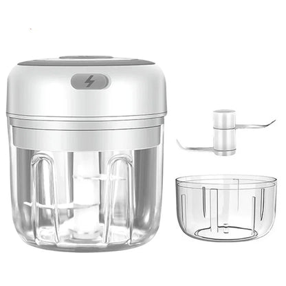 White hand blender with clear attachments on a white background