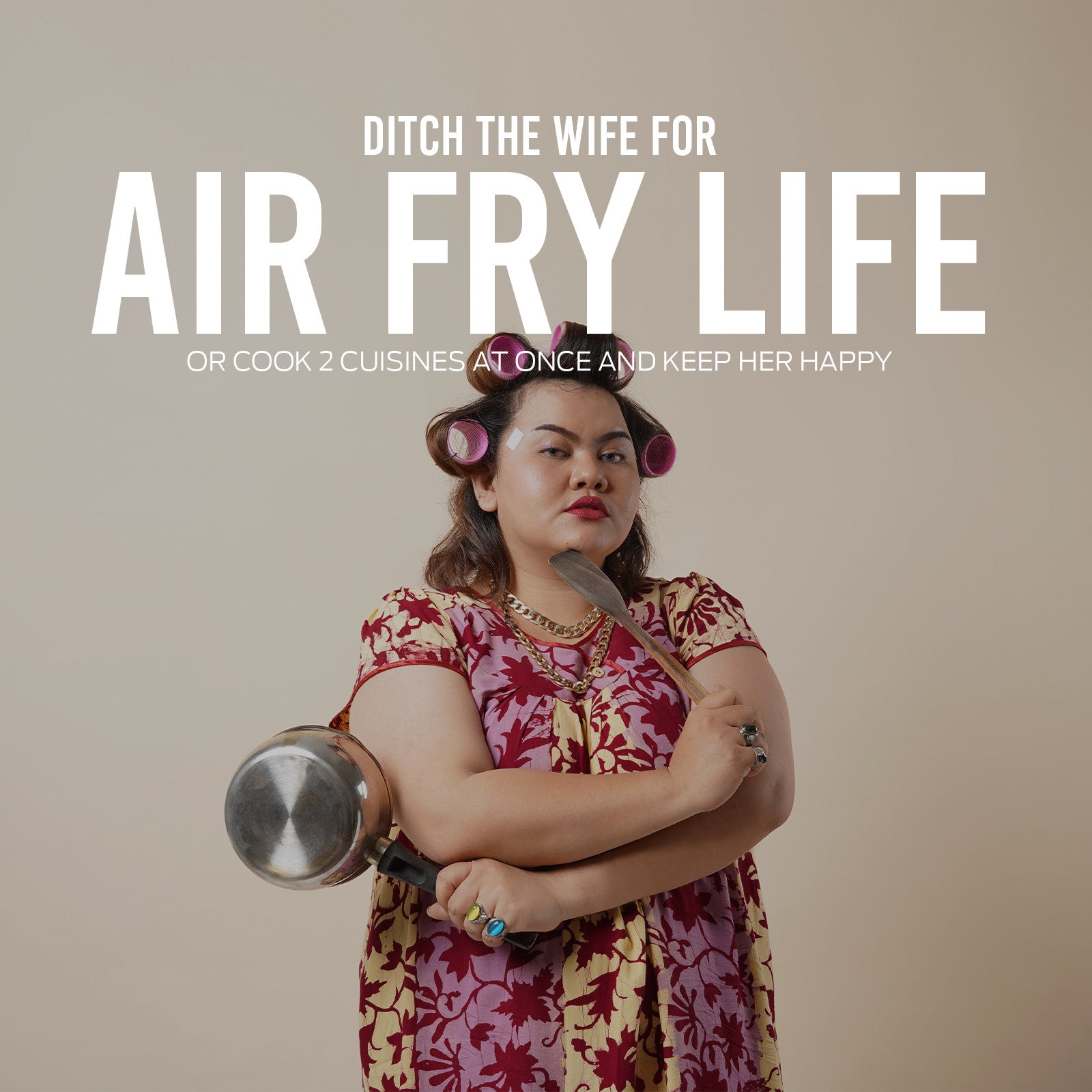 Woman holding a large frying pan with text about air frying on a beige background