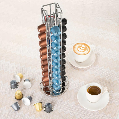 Stackable coffee capsule organizer with various colored capsules on a light surface with two cups of coffee.