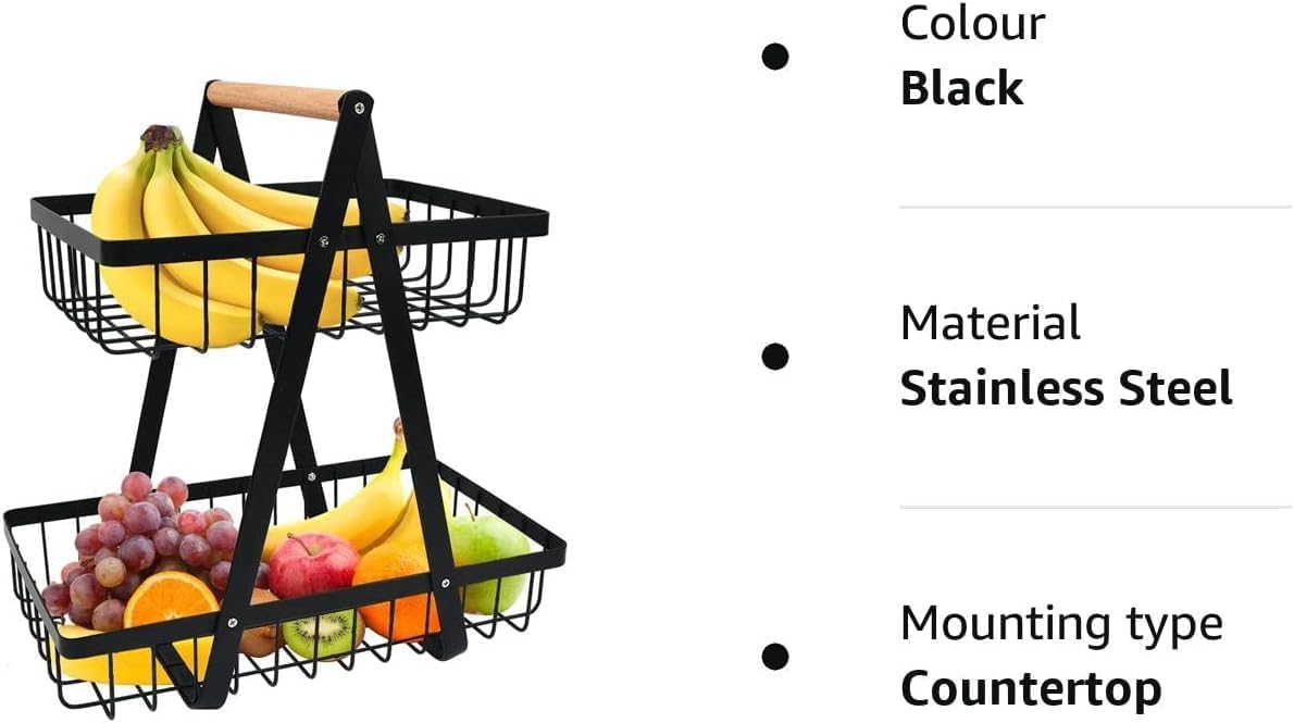 Two-tiered black metal fruit basket with fruits on a white background