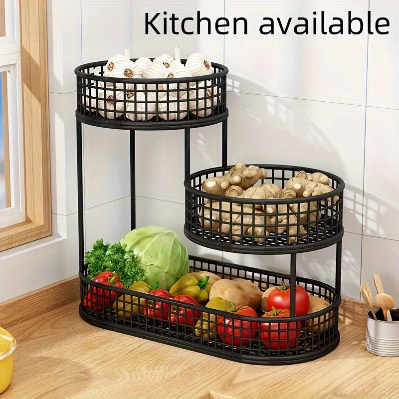 Three-tiered metal basket organizer with vegetables in a kitchen setting