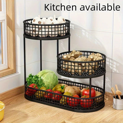 Three-tiered metal basket organizer with vegetables in a kitchen setting