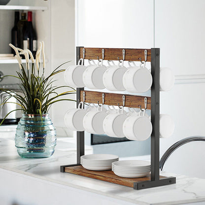 Kitchen counter with a cup rack holding white cups and bowls, next to a plant and bottles.