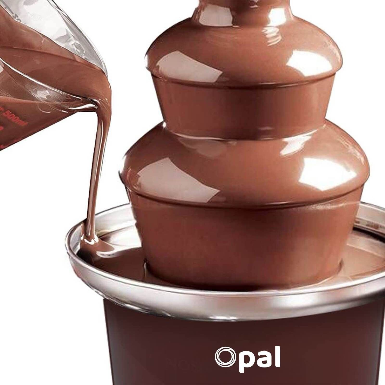 Chocolate fountain being filled with chocolate sauce, featuring the Opal brand.