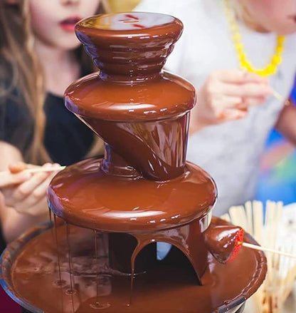 Chocolate fountain with people in the background