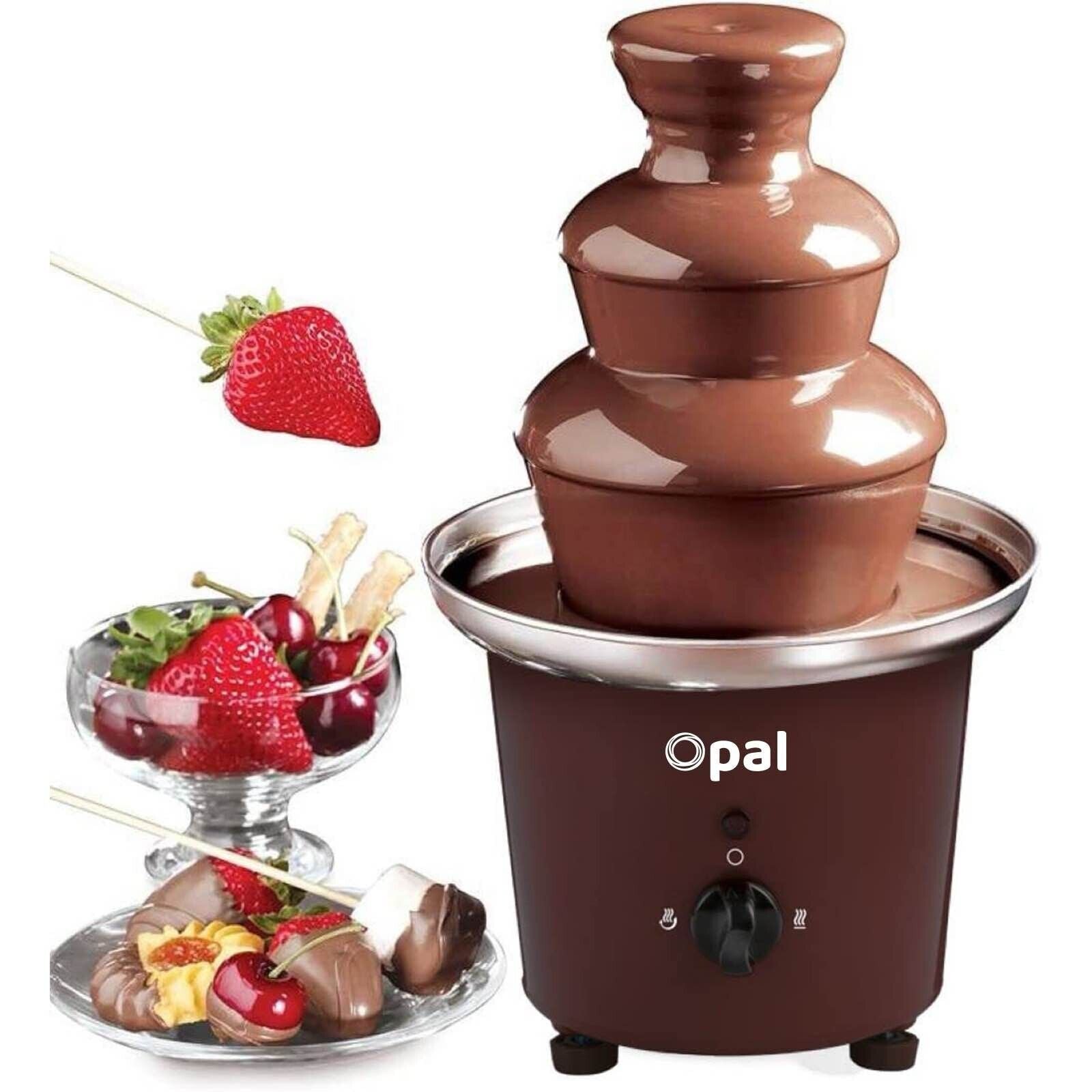 Chocolate fountain with skewers of fruit and chocolate on a white background