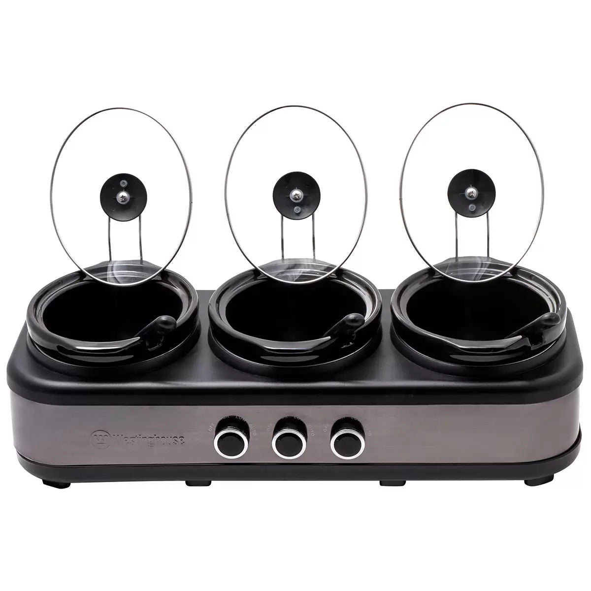 Three-burner hot plate with glass lids on a white background