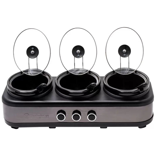 Three-burner hot plate with glass lids on a white background