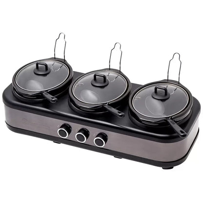 Triple burner cooktop with lids on a white background